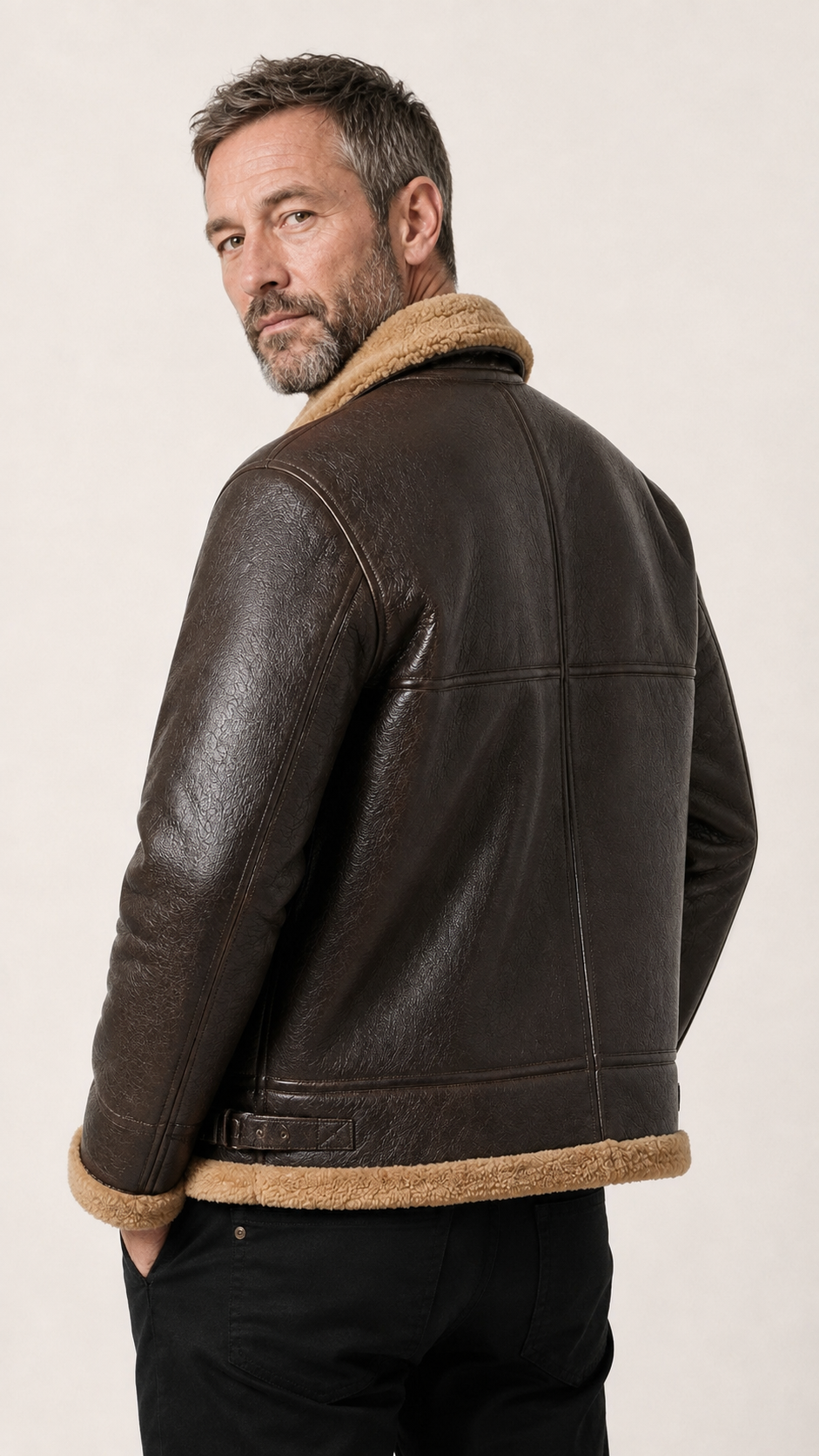 Back view of a man wearing the brown shearling B-3 jacket — British model