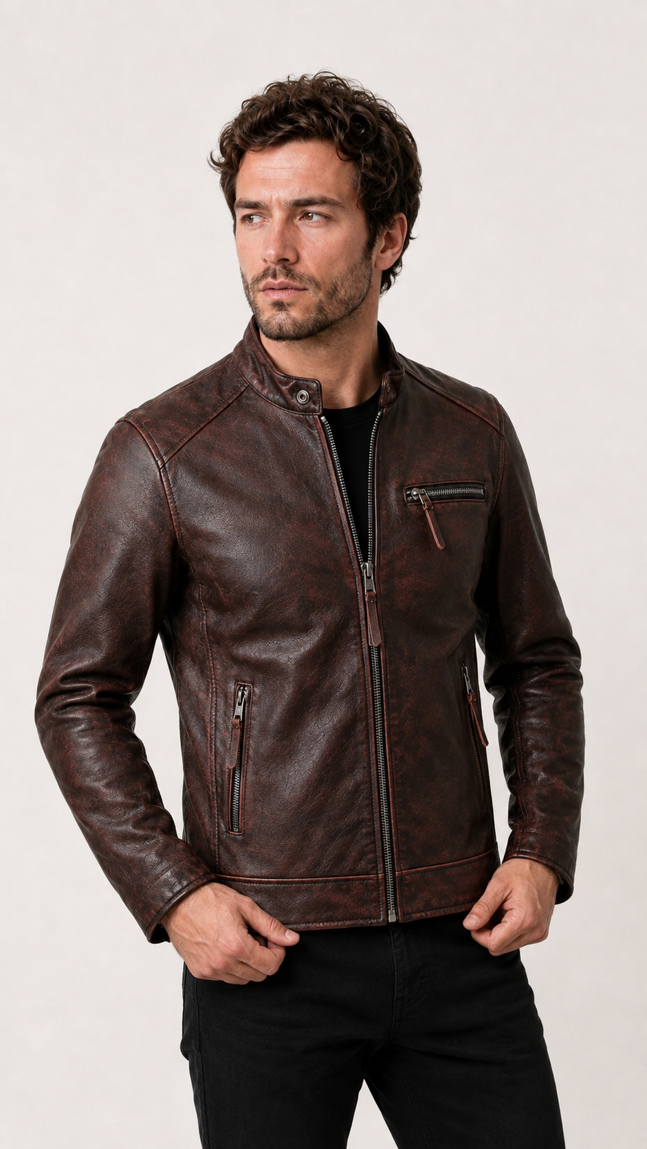 Three-quarter view of a man wearing the oxblood cafe racer jacket — British model