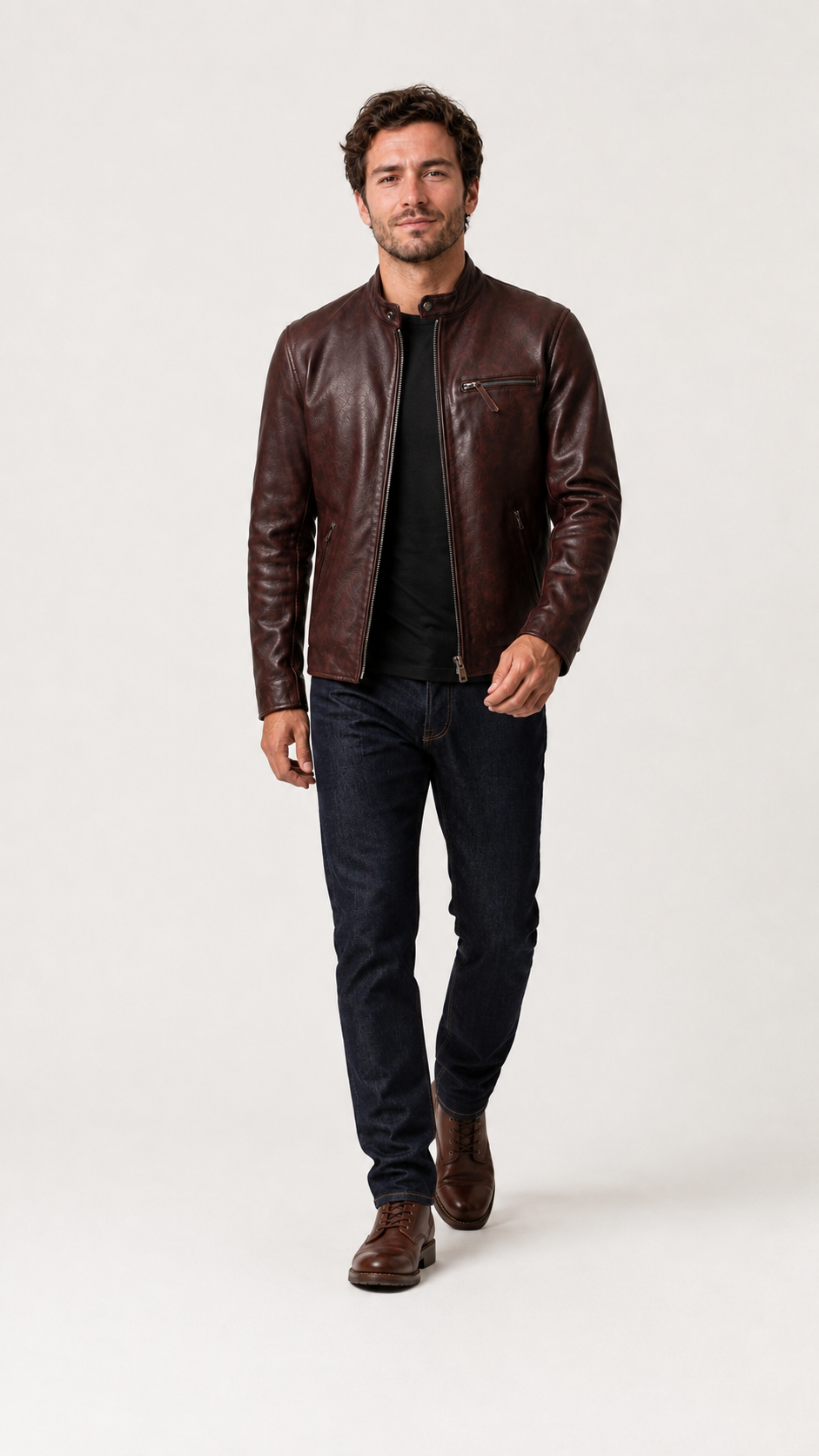 Full-length shot of a man walking in the oxblood cafe racer jacket — British model