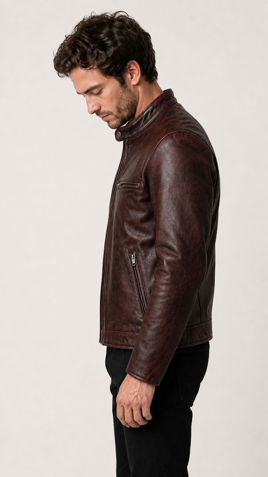 Side profile of the oxblood cafe racer leather jacket on the model — British model
