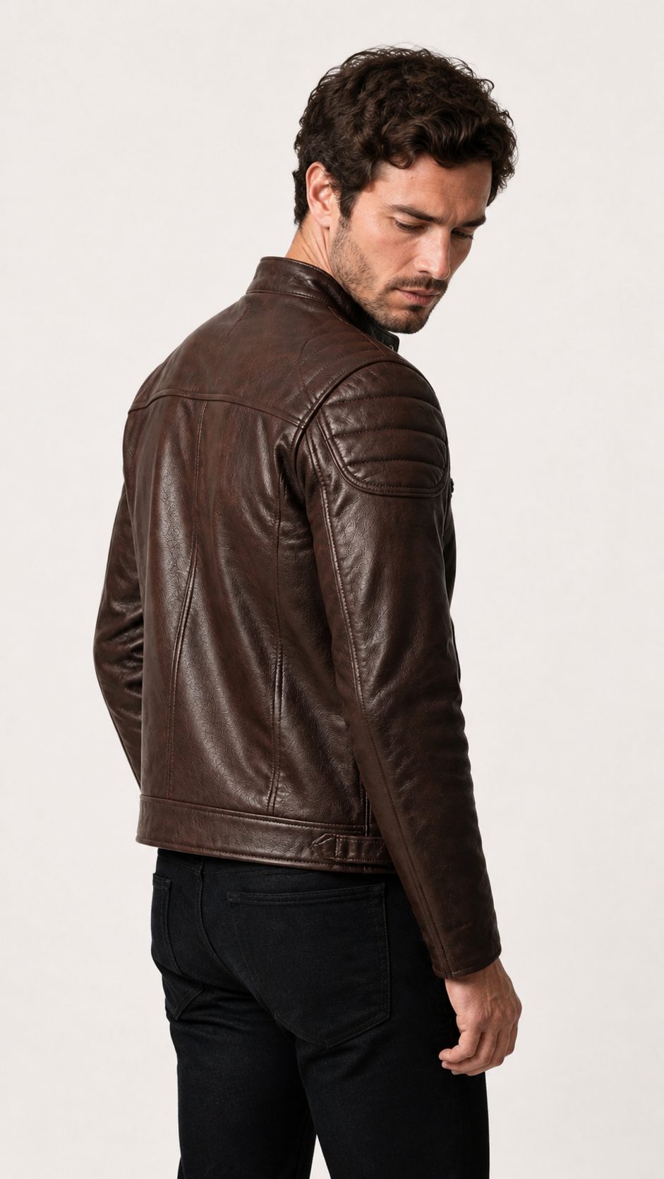 Side view of the vintage brown leather biker jacket on the model — British model